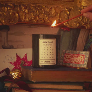 advent candle being lit